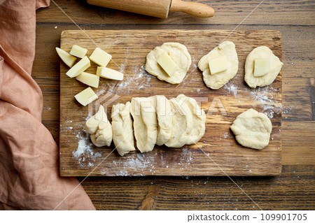 yeast dough buns filled with cheese yeast dough buns filled with cheese 109901705