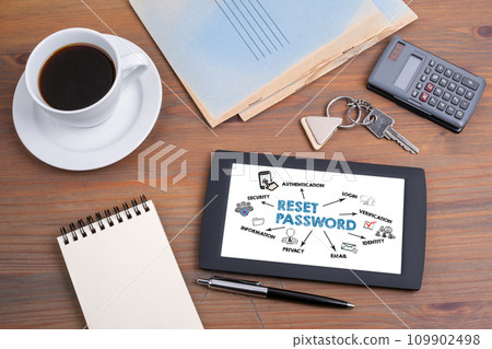 Reset Password. Text on tablet device on a wooden table Reset Password. Text on tablet device on a wooden table 109902498