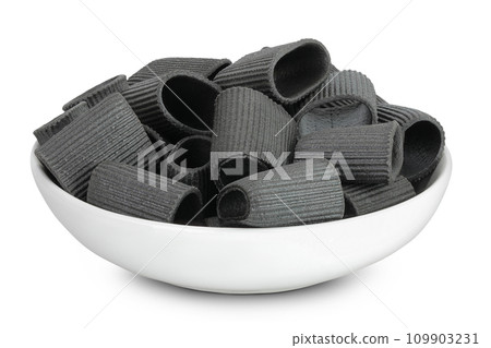 Black pasta with cuttlefish ink in ceranic bowl isolated on white background Black pasta with cuttlefish ink in ceranic bowl isolated on white background 109903231