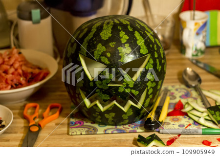 Jack'O Lantern made from watermelon for Halloween, working place 109905949