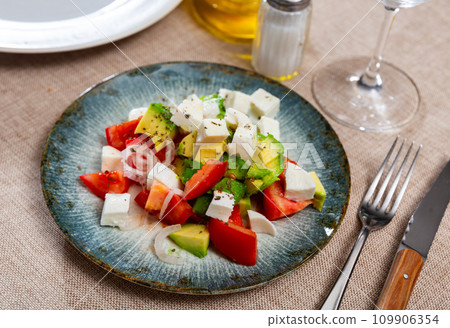Salad with avocado, tomatoes, onions and cheese Salad with avocado, tomatoes, onions and cheese 109906354