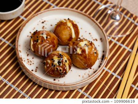 Takoyakis - octopus balls, popular Japanese snack closeup 109906619