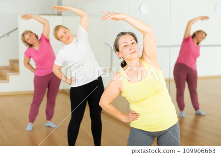 Mature women training at group dance class Mature women training at group dance class 109906663