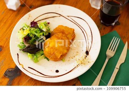 Potatoes stuffed with cod served on platter Potatoes stuffed with cod served on platter 109906755
