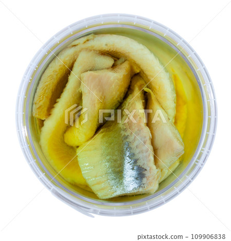 In plastic bucket containers are large pieces of salted herring fillet, freed from bones 109906838