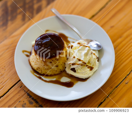 Creamy flan served on platter for dessert Creamy flan served on platter for dessert 109906923