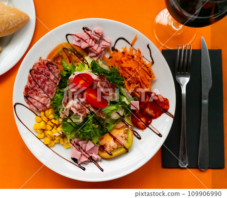 Catalan salad with sausages and tomato Catalan salad with sausages and tomato 109906990
