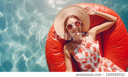Woman in Summer Dress Relaxing on Inflatable Ring in Pool Woman in Summer Dress Relaxing on Inflatable Ring in Pool 109908502