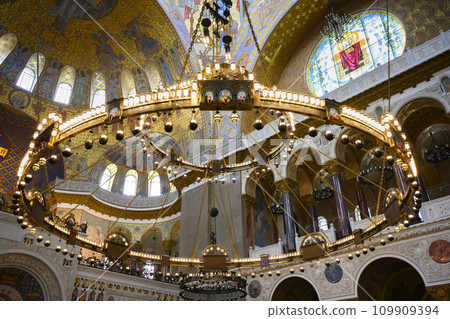 Large gilded chandelier with icons in St. Nicholas Cathedral in Kronstadt, Russia, built in 1913 109909394