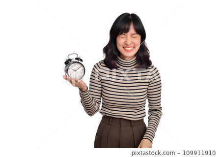 Portrait of excited young Asian woman with sweater shirt holding alarm clock isolated on white background 109911910