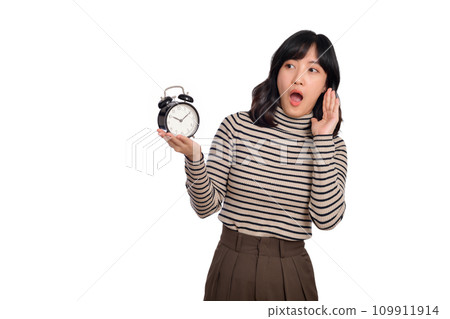 Portrait of excited young Asian woman with sweater shirt holding alarm clock isolated on white background 109911914