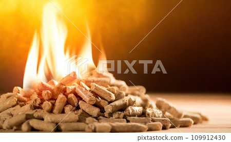 Burning Elegance: Enchanting Flames Embrace Wood Pellet Pile Burning Elegance: Enchanting Flames Embrace Wood Pellet Pile 109912430