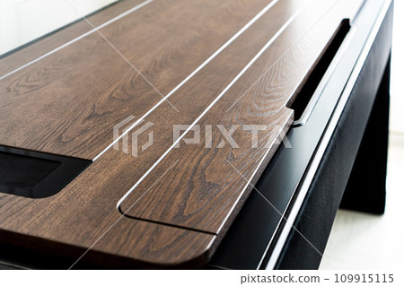 Mobile phone with wireless charger on table. Modern workplace accessory 109915115