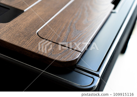 Mobile phone with wireless charger on table. Modern workplace accessory 109915116