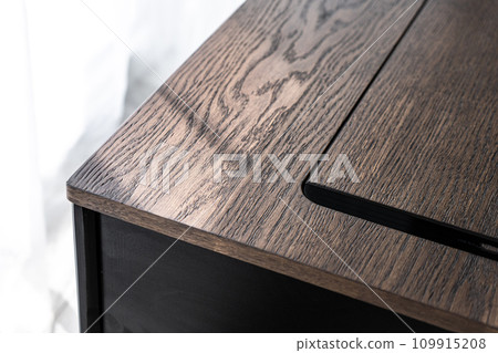 Empty rough wooden table top in the dark room Empty rough wooden table top in the dark room 109915208