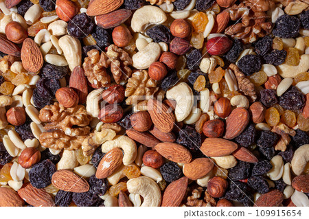 Mixed Nuts: Almonds, Walnuts, Cashews, Peanuts, Hazelnuts, Dried Prunes and Raisins 109915654