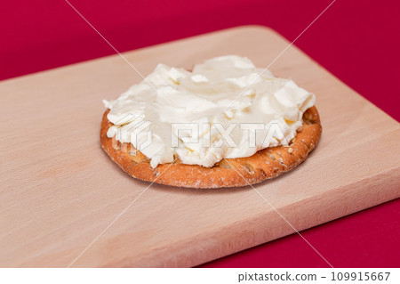 Crispy Cracker Sandwich with Cream Cheese on Wooden Board Crispy Cracker Sandwich with Cream Cheese on Wooden Board 109915667