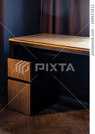 Mobile phone with wireless charger on table. Modern workplace accessory 109915812