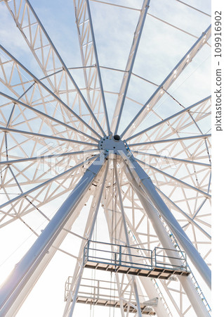 Big tall white ferris wheel in front of perfect blue sky in Bukovel. Carpathians Ukraine 109916902