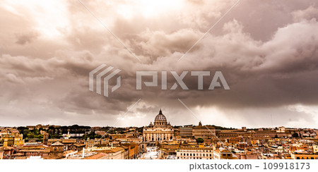 Dramatic clouds above Vatican City with St. Peter's Basilica. Panoramic skyline view from Castel Sant'Angelo, Rome, Italy. Dramatic clouds above Vatican City with St. Peter's Basilica. Panoramic skyline view from Castel Sant'Angelo, Rome, Italy. 109918173