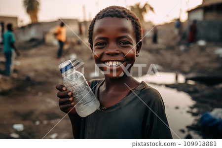 African boy with water bottle in hand. Black boy enjoying the water. 109918881