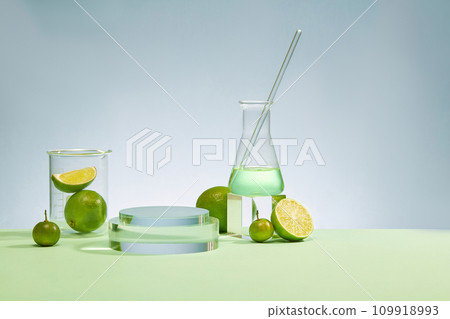 Laboratory beaker, Erlenmeyer flask, glass rod, glass platform and fresh lemon stand out against the fresh blue background. Display products with ideal space. Laboratory beaker, Erlenmeyer flask, glass rod, glass platform and fresh lemon stand out against the fresh blue background. Display products with ideal space. 109918993