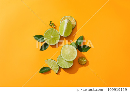 On a dark yellow background there are fresh lemons, kumquats and green leaves. Supplement vitamin C for the body from fresh fruits. Copy space for lemon-related product ads. On a dark yellow background there are fresh lemons, kumquats and green leaves. Supplement vitamin C for the body from fresh fruits. Copy space for lemon-related product ads. 109919139