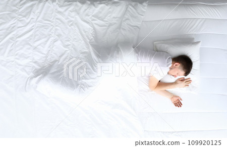 Young caucasian beauty woman sleeping on white bed Young caucasian beauty woman sleeping on white bed 109920125