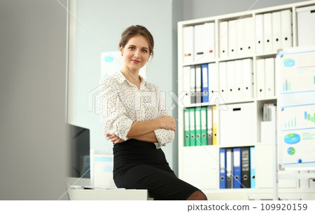 Businesswoman sitting at workplace Businesswoman sitting at workplace 109920159