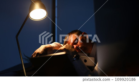 Man sleeping on office table evening time Man sleeping on office table evening time 109920186