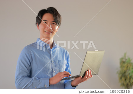 Engineer 1 smiling with a laptop 109920216