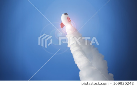 White rocket at high speed flies into space against White rocket at high speed flies into space against 109920248
