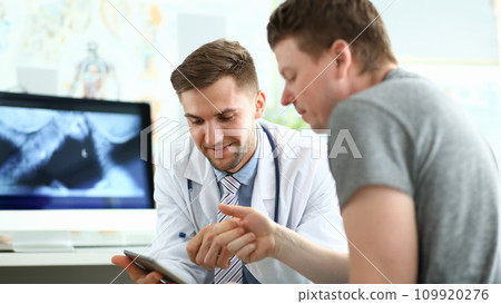 Doctor talking with man Doctor talking with man 109920276