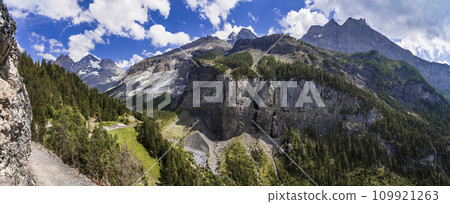 Idyllic swiss  scenery with snowy peaks of Alps mountains near Kandersteg village . Hiking route to Oeschinensee lake.  Switzerland nature 109921263