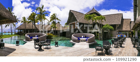 luxury 5 star hotel territory with swimming pool and bar zone - Constance Belle Mare Plage. Mauritius island. Pointe de flacq , Belle Mare. February 2020 luxury 5 star hotel territory with swimming pool and bar zone - Constance Belle Mare Plage. Mauritius island. Pointe de flacq , Belle Mare. February 2020 109921290