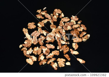 Delicious walnut grains on a dark background. Delicious walnut grains on a dark background. 109921382
