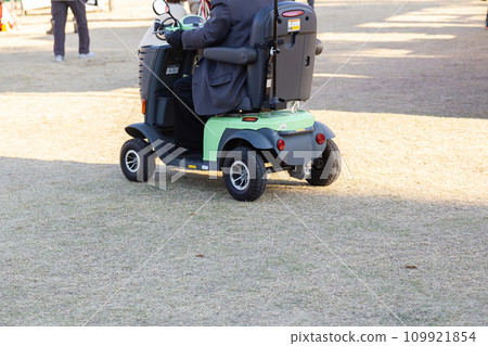 Elderly people traveling by electric cart Elderly people traveling by electric cart 109921854