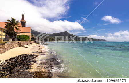 Coastal landscape with Anse Royale - Saint Joseph, the Worker church 109923275