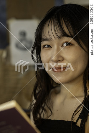 Young woman reading in a chic room Young woman reading in a chic room 109923568