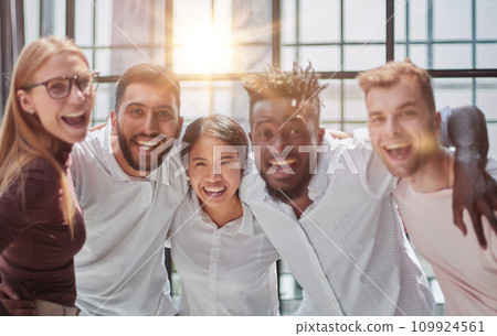Strong and creative team. Group of business people and smiling at camera Strong and creative team. Group of business people and smiling at camera 109924561