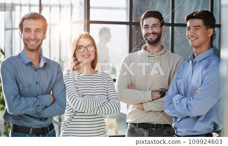 business people standing and looking straight ahead in a modern office business people standing and looking straight ahead in a modern office 109924603