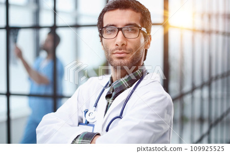 Portrait of a handsome male doctor. medical staff Portrait of a handsome male doctor. medical staff 109925525