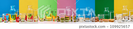 Creative collage with glasses of water and fruits, vegetables, junk food behind it against multicolored background. Concept of healthy eating and nutrition 109925657