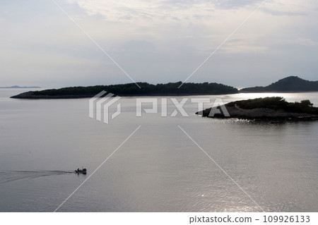 Fishermans in boat sailing out Fishermans in boat sailing out 109926133