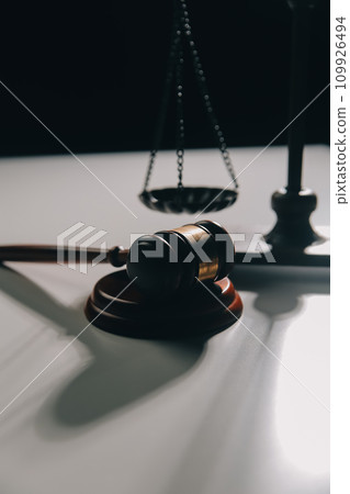 image of judge's hammer, scales lady of justice, law book, laptop computer and contract documents with pen concept of law and justice. image of judge's hammer, scales lady of justice, law book, laptop computer and contract documents with pen concept of law and justice. 109926494