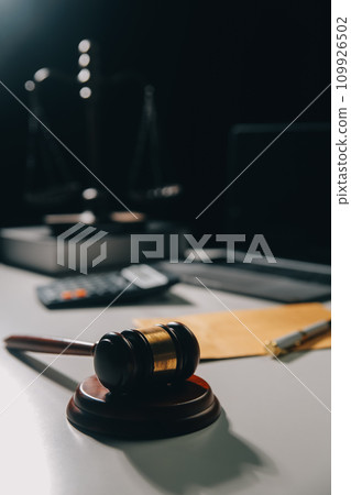 image of judge's hammer, scales lady of justice, law book, laptop computer and contract documents with pen concept of law and justice. 109926502