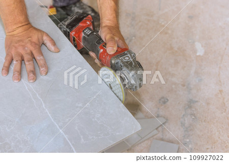 Sharp diamond blade on powerful electric grinder with polishing corner to tiles 109927022