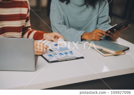 Finance manager meeting discussing company growth project success financial statistics, professional investor working start up project for strategy plan with document, laptop and digital tablet. 109927096