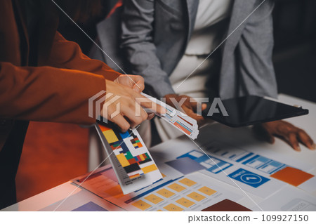 team of UI UX web designer are working together to develop mobile responsive websites. Mobile Mockup 109927150