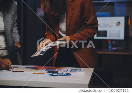 team of UI UX web designer are working together to develop mobile responsive websites. Mobile Mockup team of UI UX web designer are working together to develop mobile responsive websites. Mobile Mockup 109927151